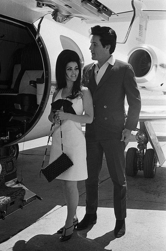 Elvis Presley and wife, Priscilla, flying off together (late 1960s) 53